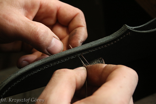Sewing the sheath for one of knifes in "clean" sector of workshop